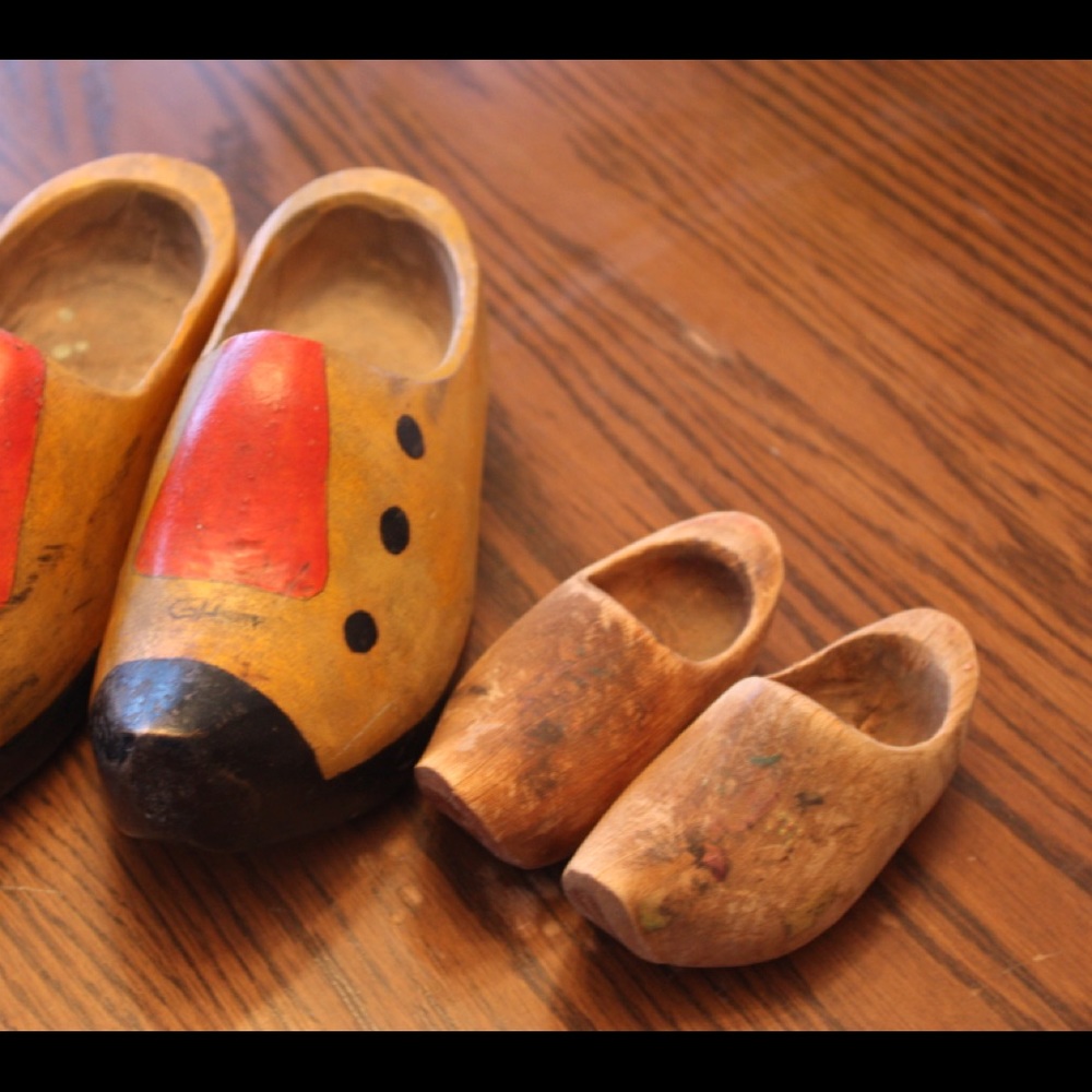 Two sets of wooden shoes.